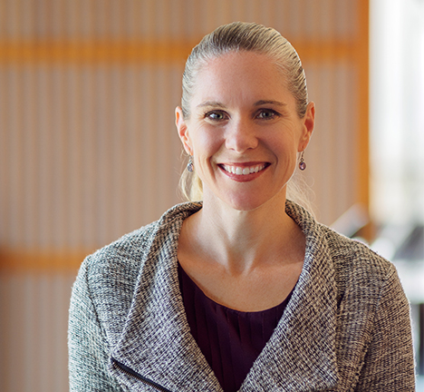 Headshot of Britt Glaunsinger in the Li Ka Shing building hallway