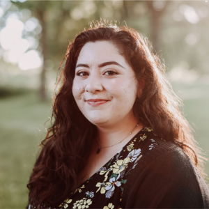 Sarah Batarseh headshot in front of blurred tree scene